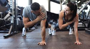 Toning Bingo Wings: Your Ultimate Guide to Sculpting Sleek Arms at the Gym 3 Fitness trainer demonstrating arm toning exercises Hassocks