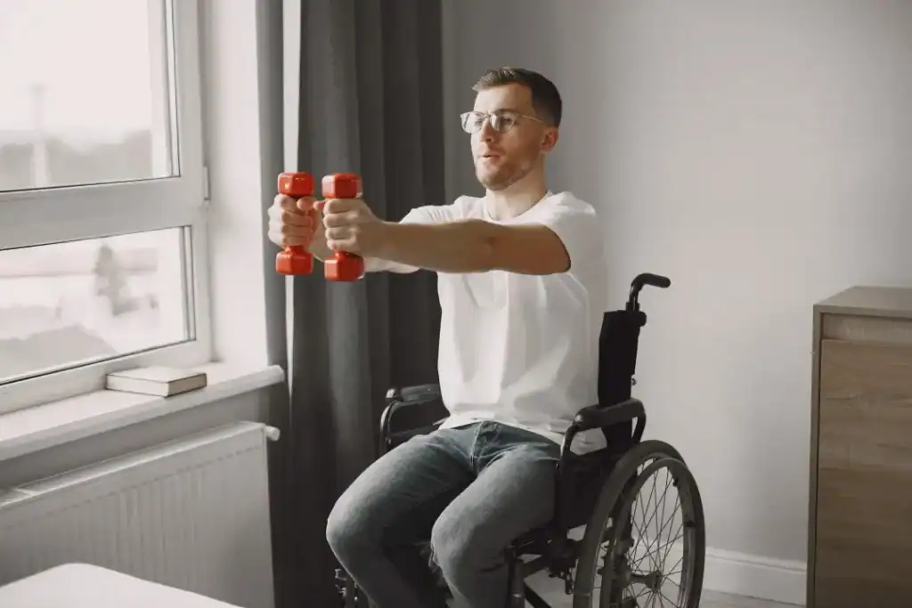 Image of man doing exercise in his wheelchair to aid weight loss Hassocks
