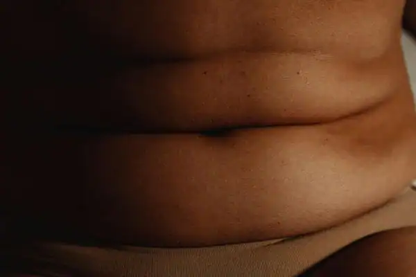 The Hidden Connection: How Stress Shapes Your Fitness and Body Composition 3 image of what stress can do on the stomach area and how Lipo 360 Hassocks can help to change your body shape.